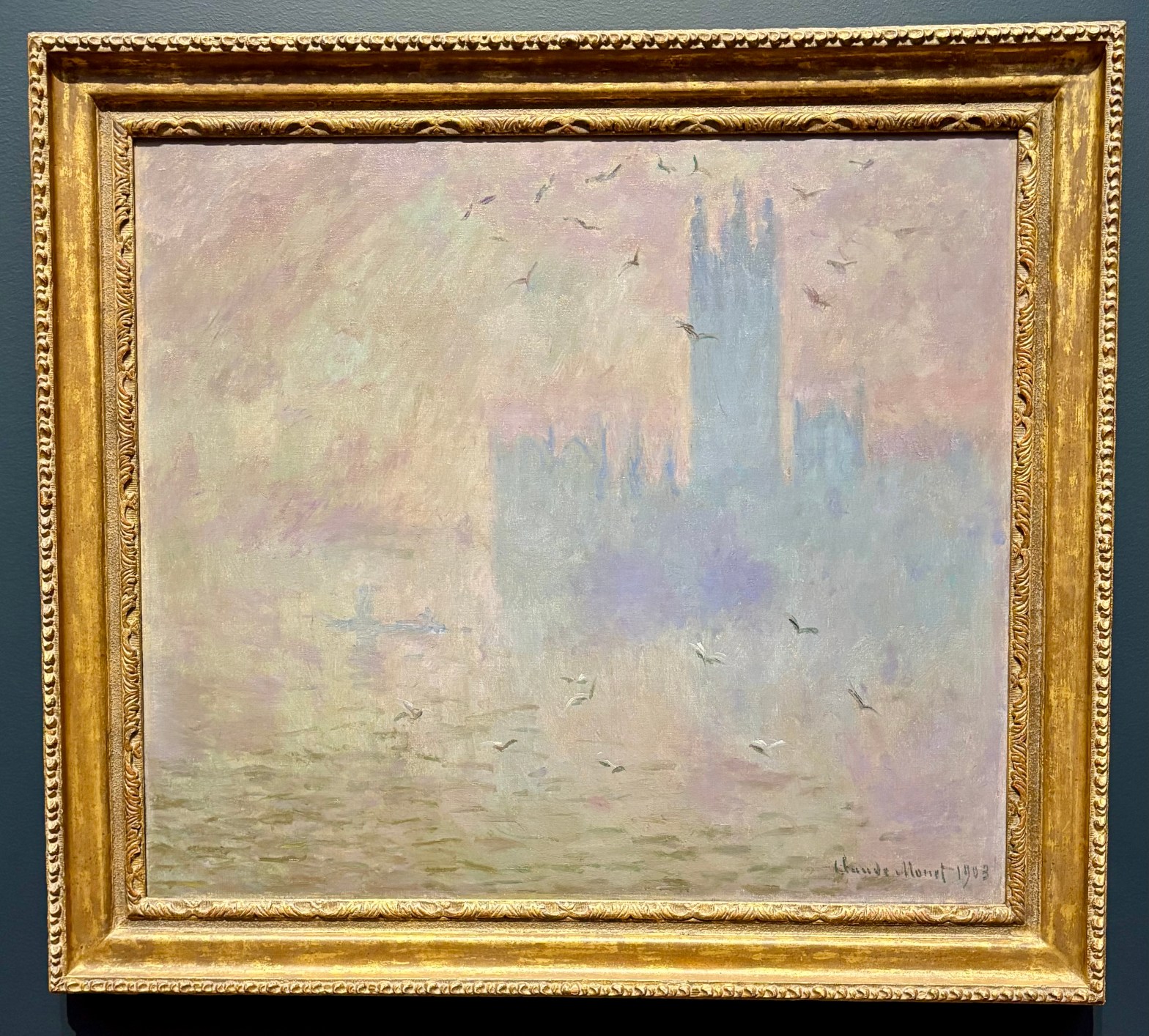 Claude Monet's "The Houses of Parliament, Seagulls, 1903" showing the Houses through a fog with a flock of seagulls soaring through the air.