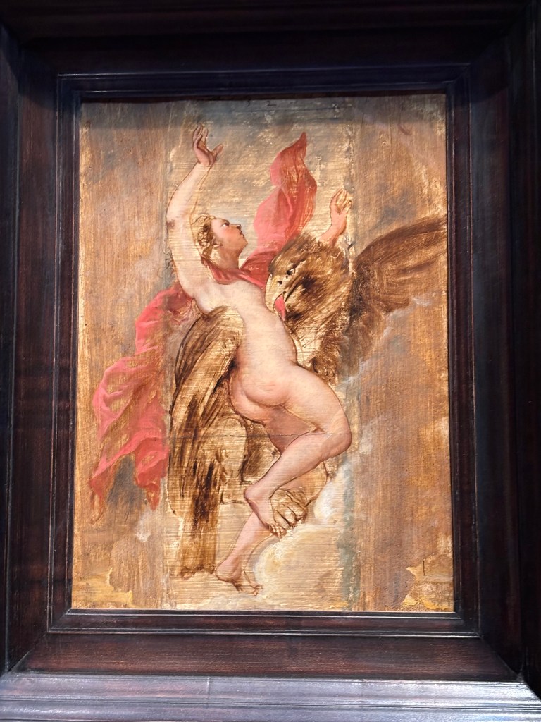 Ganymede, blond-haired and naked, is grabbed by a large brown eagle.